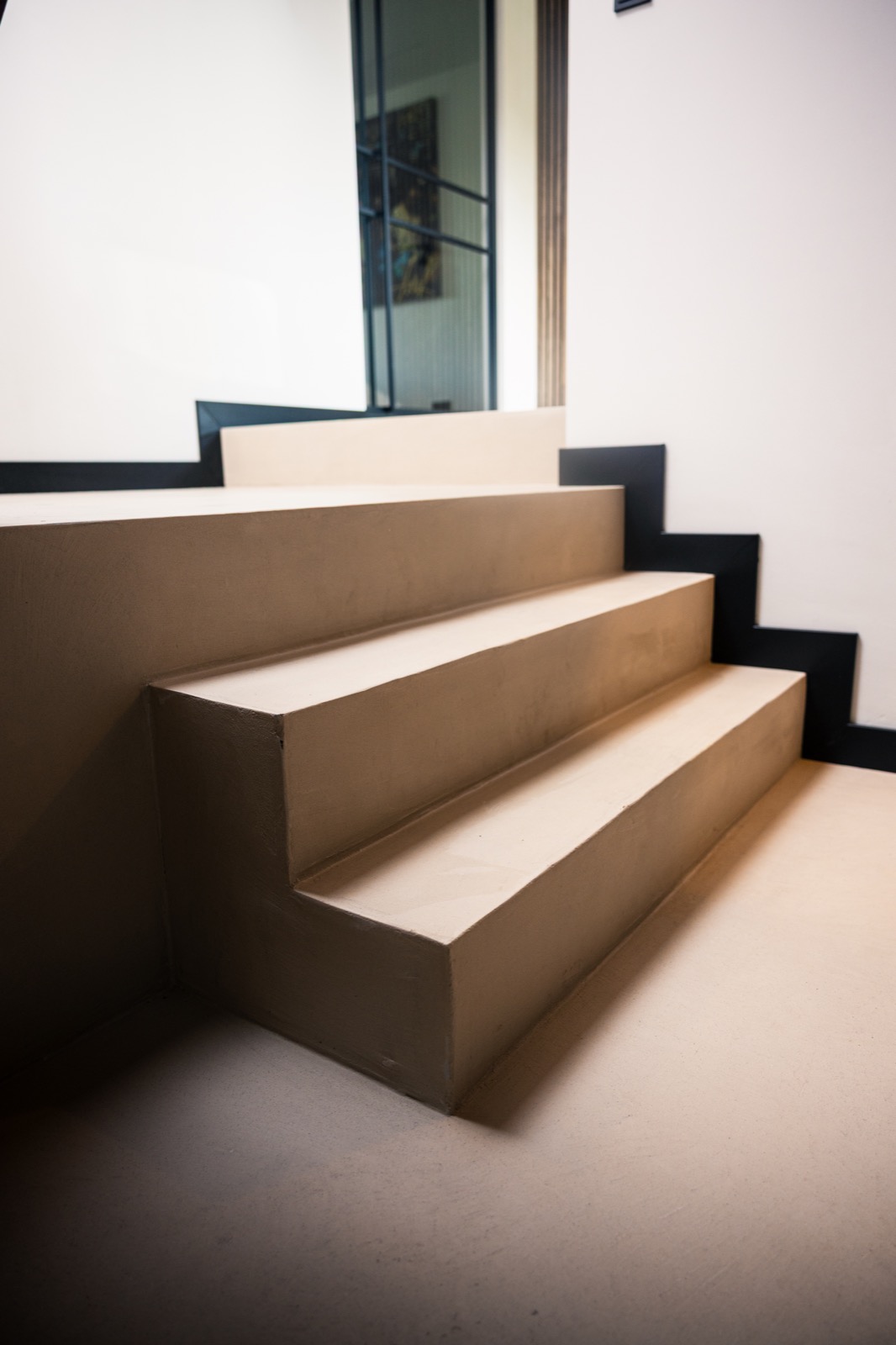 trap met microcement afwerking