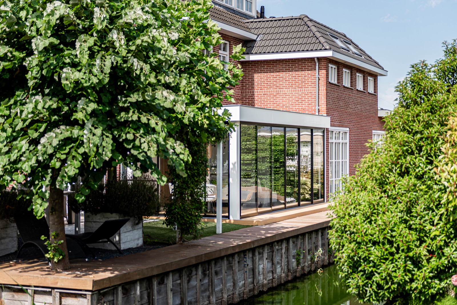 tuinkamer met glazen vouwwanden
